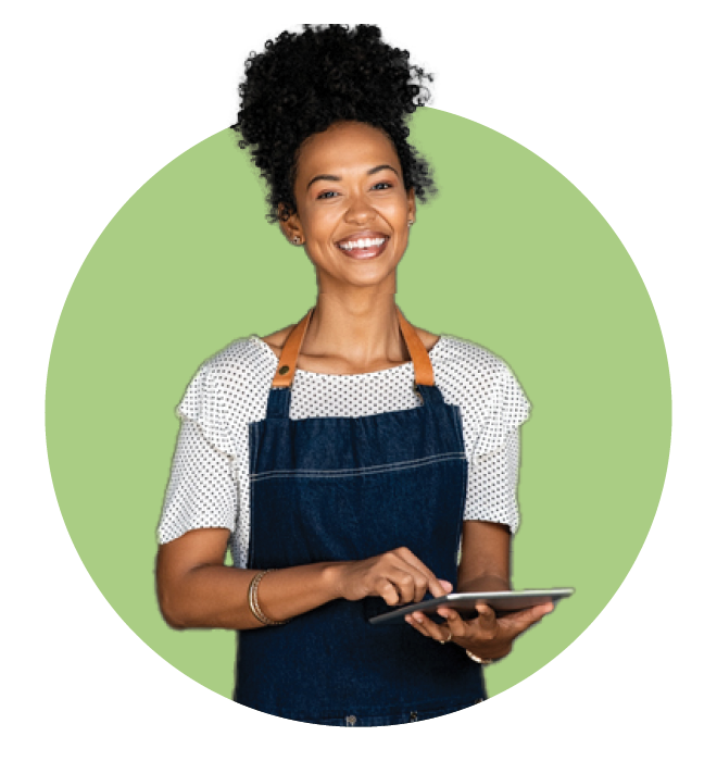 Smiling female business owner holding a tablet